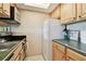 Functional kitchen features stainless appliances, light cabinetry, and a bright ambiance, perfect for culinary adventures at 36750 Us 19 N # 22207, Palm Harbor, FL 34684
