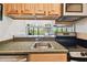 Convenient kitchen open to the living area, featuring sleek stainless appliances and bright ambiance at 36750 Us 19 N # 22207, Palm Harbor, FL 34684