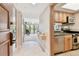 Charming kitchen featuring stainless steel appliances, wood cabinets, and open view to bright living area at 36750 Us 19 N # 22207, Palm Harbor, FL 34684