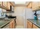 Well-lit kitchen with stainless steel appliances, light wood cabinetry, open to living area for easy entertaining at 36750 Us 19 N # 22207, Palm Harbor, FL 34684