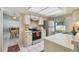 Bright kitchen featuring modern appliances and a view into the adjacent dining area, perfect for Gathering meals at 4015 Mountain Springs Ln, Tampa, FL 33624