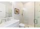 Bright bathroom with white vanity and glass shower at 4117 W Platt St, Tampa, FL 33609