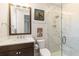 Bathroom with dark wood vanity and glass shower at 4117 W Platt St, Tampa, FL 33609