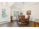 Formal dining room with elegant chandelier lighting and a round table with decorative chairs at 4117 W Platt St, Tampa, FL 33609