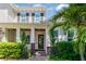 Inviting front entrance showcasing a covered porch with decorative columns and lush landscaping at 4117 W Platt St, Tampa, FL 33609