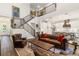 Open-concept living room featuring high ceilings, a staircase, and seamless flow into the kitchen at 4117 W Platt St, Tampa, FL 33609