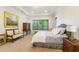 Spacious bedroom features tray ceilings, large windows, and stylish furnishings at 4117 W Platt St, Tampa, FL 33609