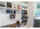 Functional mudroom with built-in bench, storage cubbies, and ample space for organization at 4117 W Platt St, Tampa, FL 33609