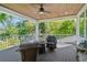 Covered porch with comfortable seating and ceiling fan at 4117 W Platt St, Tampa, FL 33609