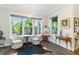 Cozy sitting area featuring large windows overlooking lush greenery, creating a serene atmosphere at 4117 W Platt St, Tampa, FL 33609