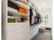 Organized walk-in closet with custom shelving, drawers, and ample storage space at 4117 W Platt St, Tampa, FL 33609