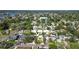 An aerial view of the property in a neighborhood setting with access to water at 4126 Harrisburg Ne St, St Petersburg, FL 33703