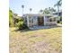 Large backyard with sunroom featuring sliding glass doors for natural light at 4126 Harrisburg Ne St, St Petersburg, FL 33703