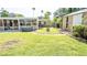 Expansive backyard featuring a spa and sunroom area for outdoor enjoyment at 4126 Harrisburg Ne St, St Petersburg, FL 33703