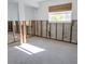 Unfinished basement space ready for customization, showcasing ample natural light from the window at 4126 Harrisburg Ne St, St Petersburg, FL 33703