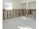Unfinished basement space ready for customization, showcasing ample natural light from the window at 4126 Harrisburg Ne St, St Petersburg, FL 33703