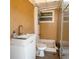 An outdoor bathroom featuring a shower, toilet, and sink at 4126 Harrisburg Ne St, St Petersburg, FL 33703