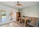 The dining room features French doors, a custom dining table, and a stylish banquette seating arrangement at 4126 Harrisburg Ne St, St Petersburg, FL 33703