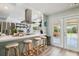 This modern kitchen showcases a breakfast bar and quartz countertops, perfect for casual dining and entertaining guests at 4126 Harrisburg Ne St, St Petersburg, FL 33703