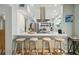 This modern kitchen showcases a breakfast bar and quartz countertops, perfect for casual dining and entertaining guests at 4126 Harrisburg Ne St, St Petersburg, FL 33703