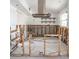 Renovated kitchen featuring new tile flooring, updated electrical, and open shelving for a modern, stylish look at 4126 Harrisburg Ne St, St Petersburg, FL 33703
