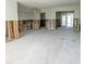 Unfinished living room with concrete floor and exposed framing, ready for customization at 4126 Harrisburg Ne St, St Petersburg, FL 33703