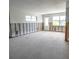 Unfinished living room with concrete floor and exposed framing, ready for customization at 4126 Harrisburg Ne St, St Petersburg, FL 33703