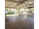 Expansive sunroom with tile floors and multiple glass doors offers peaceful outdoor views at 4126 Harrisburg Ne St, St Petersburg, FL 33703