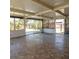 Large sunroom features tile flooring and sliding glass doors to enjoy the outdoor view at 4126 Harrisburg Ne St, St Petersburg, FL 33703