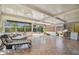 Inviting sunroom with tile flooring, comfortable seating, and views of the lush outdoors at 4126 Harrisburg Ne St, St Petersburg, FL 33703