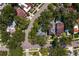 An aerial view showcases a residential neighborhood with lush trees, showcasing the layout of the neighborhood at 43 Aegean Ave, Tampa, FL 33606