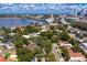 Scenic aerial view of a charming neighborhood with lush greenery and Tampa skyline backdrop at 43 Aegean Ave, Tampa, FL 33606