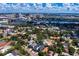 Waterfront neighborhood aerial view showcasing tree-lined streets, Tampa skyline, and beautiful homes at 43 Aegean Ave, Tampa, FL 33606