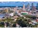 Expansive cityscape view with modern buildings, lush trees, and serene waterways under a partly cloudy sky at 43 Aegean Ave, Tampa, FL 33606