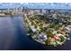 Aerial view of a waterfront community with stunning homes, private docks, and a scenic bay at 43 Aegean Ave, Tampa, FL 33606