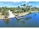Aerial view featuring a boat ramp, a lake, and green spaces at 5128 Admiral Pointe Dr, Apollo Beach, FL 33572