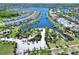Expansive aerial shot of a waterfront community with lush landscaping and boat docks at 5128 Admiral Pointe Dr, Apollo Beach, FL 33572