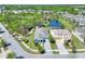 Discover a beautiful home with a well-manicured lawn and scenic pond views from an aerial perspective at 5128 Admiral Pointe Dr, Apollo Beach, FL 33572