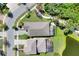 An aerial view showcases the roof and backyard of the property, and the surrounding neighborhood at 5128 Admiral Pointe Dr, Apollo Beach, FL 33572