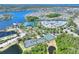 Community aerial view showing tennis courts, lake and community with beautiful manicured grounds in a waterfront neighborhood at 5128 Admiral Pointe Dr, Apollo Beach, FL 33572