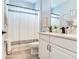 Bright, clean bathroom featuring a vanity with drawers, modern fixtures, and a shower-tub combination at 5128 Admiral Pointe Dr, Apollo Beach, FL 33572