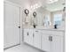 Bathroom with a double vanity and sinks, tiled floors, and lots of storage space at 5128 Admiral Pointe Dr, Apollo Beach, FL 33572