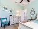 Bedroom features a whitewashed dresser, cool-toned walls, and a comfy single bed with coordinated decor at 5128 Admiral Pointe Dr, Apollo Beach, FL 33572