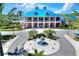 Stunning exterior of a grand home featuring a fountain, lush landscaping, and a charming entrance at 5128 Admiral Pointe Dr, Apollo Beach, FL 33572