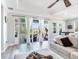 Spacious living room boasts sliding glass doors leading to a screened lanai and backyard at 5128 Admiral Pointe Dr, Apollo Beach, FL 33572