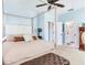 This primary bedroom offers lots of natural light, ensuite access, and carpet flooring at 5128 Admiral Pointe Dr, Apollo Beach, FL 33572