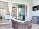 Relax on the outdoor patio with access to the home's interior and convenient features like a mini-fridge at 5128 Admiral Pointe Dr, Apollo Beach, FL 33572