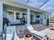 Enjoy the back patio with a grill, treadmill, and comfortable seating for outdoor relaxation and entertainment at 5128 Admiral Pointe Dr, Apollo Beach, FL 33572