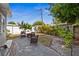Outdoor seating area, surrounded by lush greenery, on a brick patio in a fenced yard at 5758 20Th N Ave, St Petersburg, FL 33710