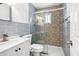 Beautifully renovated bathroom with a tiled shower, modern fixtures, and elegant finishes at 5758 20Th N Ave, St Petersburg, FL 33710